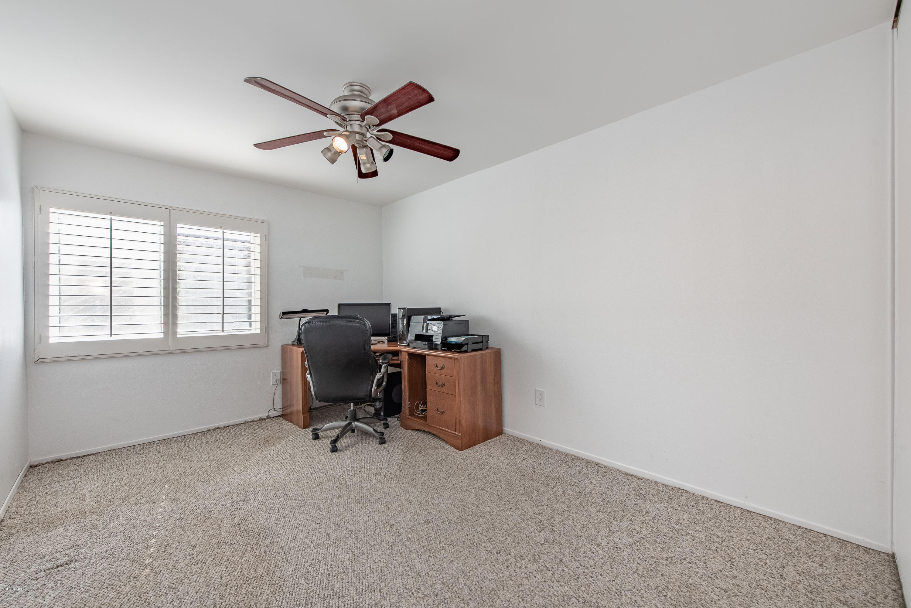 15430 Kernvale Avenue Moorpark, CA 93021 - Photo 14 of 16 a room with a workspace