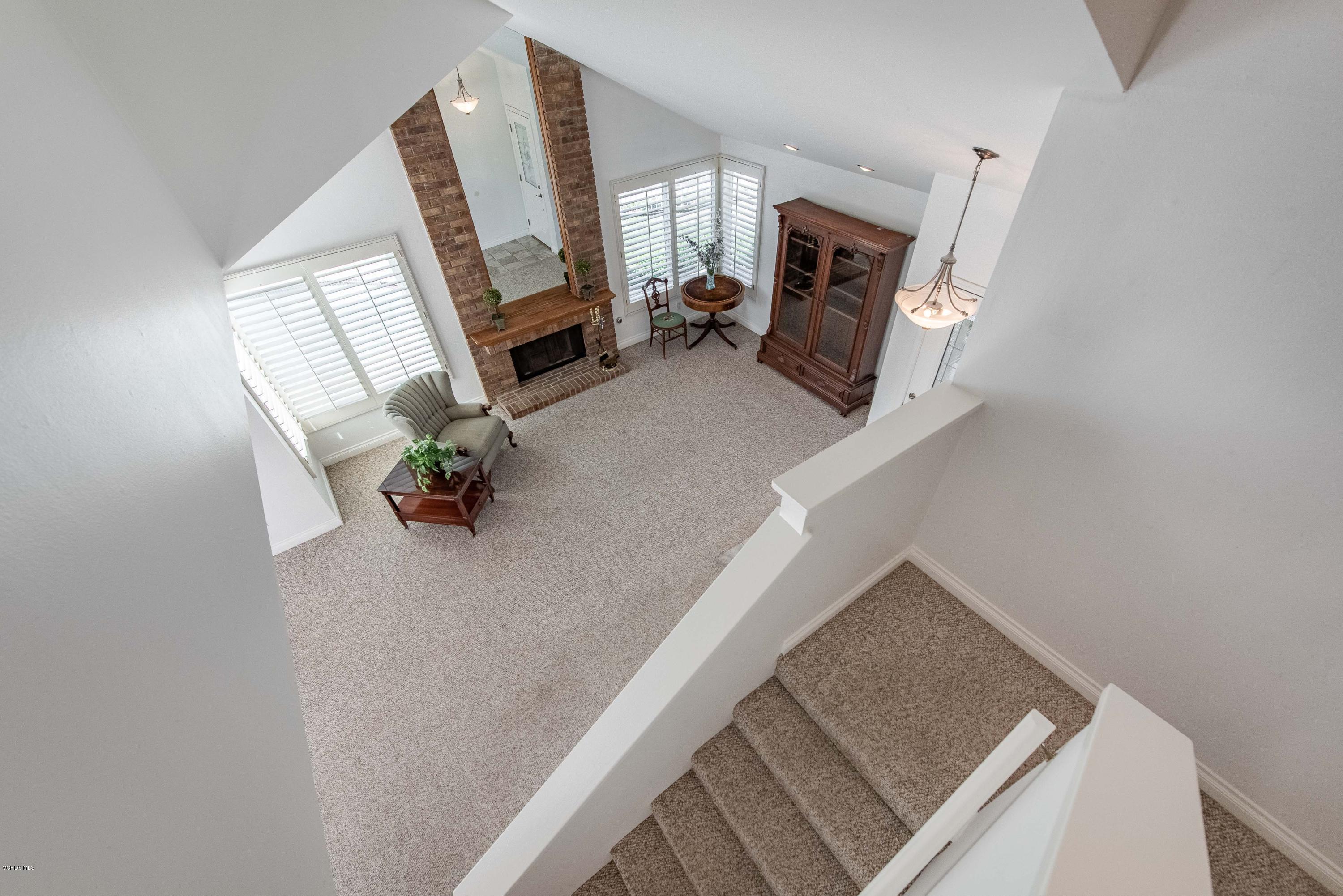 15430 Kernvale Avenue Moorpark, CA 93021 - Photo 15 of 16 a living room with furniture and a fireplace