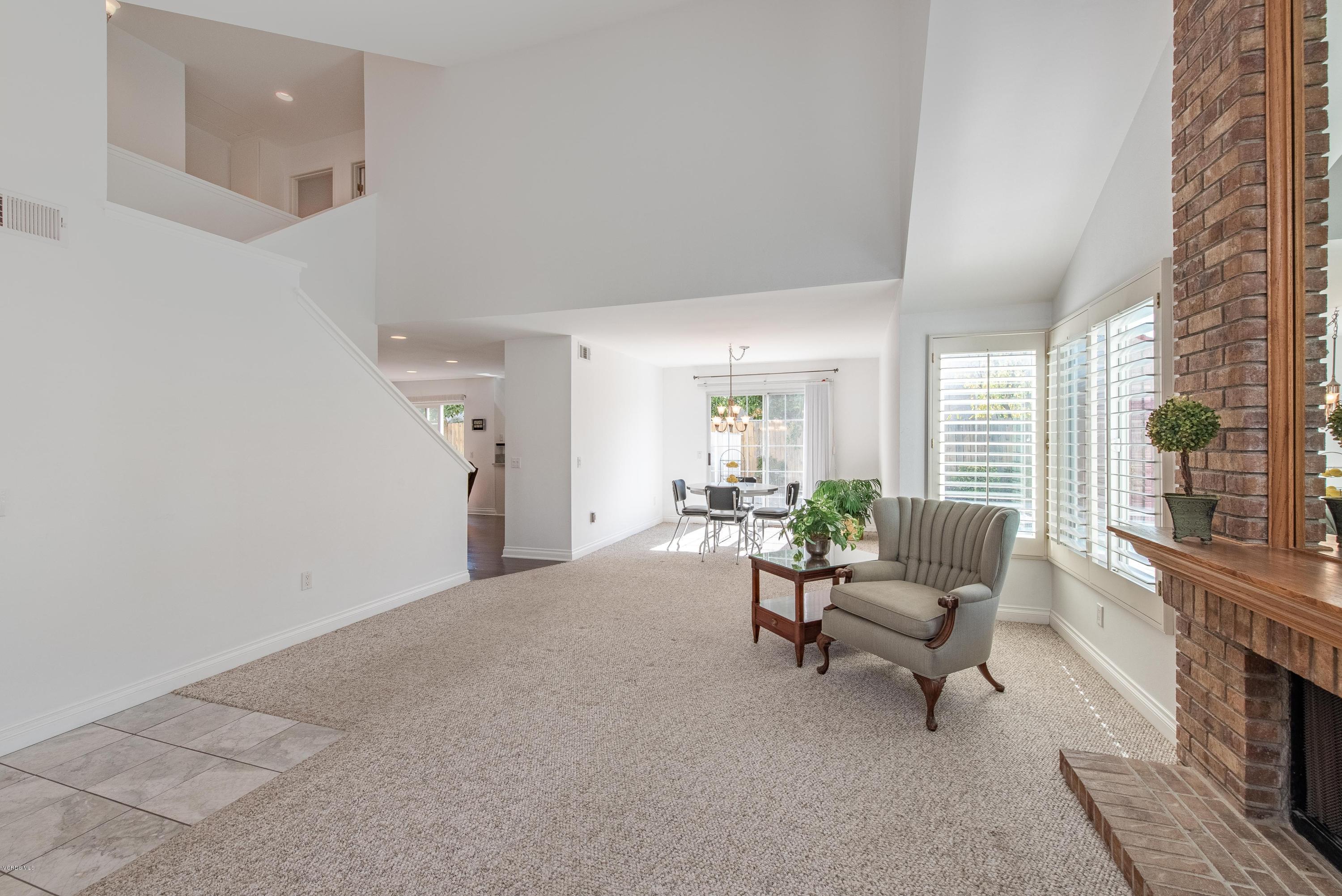 15430 Kernvale Avenue Moorpark, CA 93021 - Photo 4 of 16 a living room with furniture and a fireplace