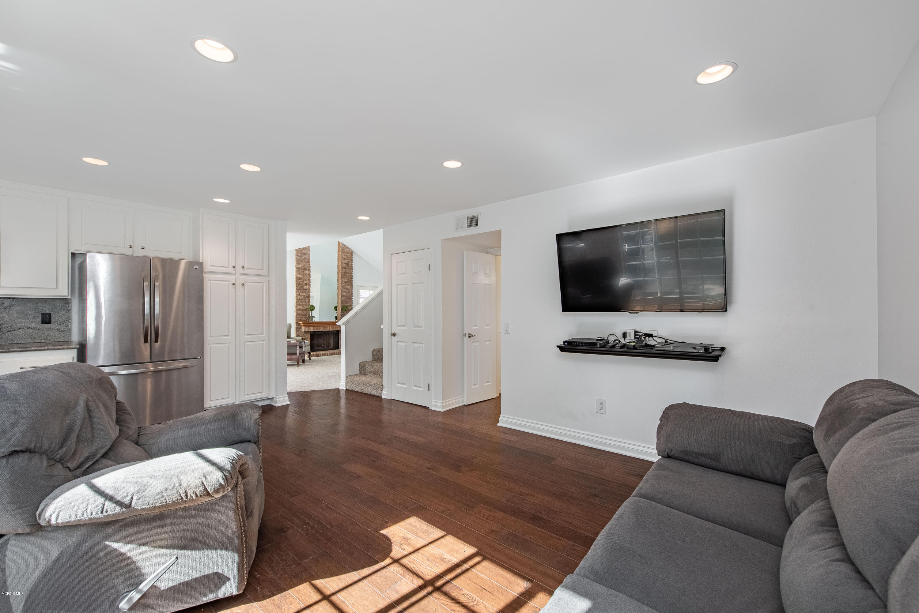 15430 Kernvale Avenue Moorpark, CA 93021 - Photo 7 of 16 a living room with furniture wooden floor and a flat screen tv