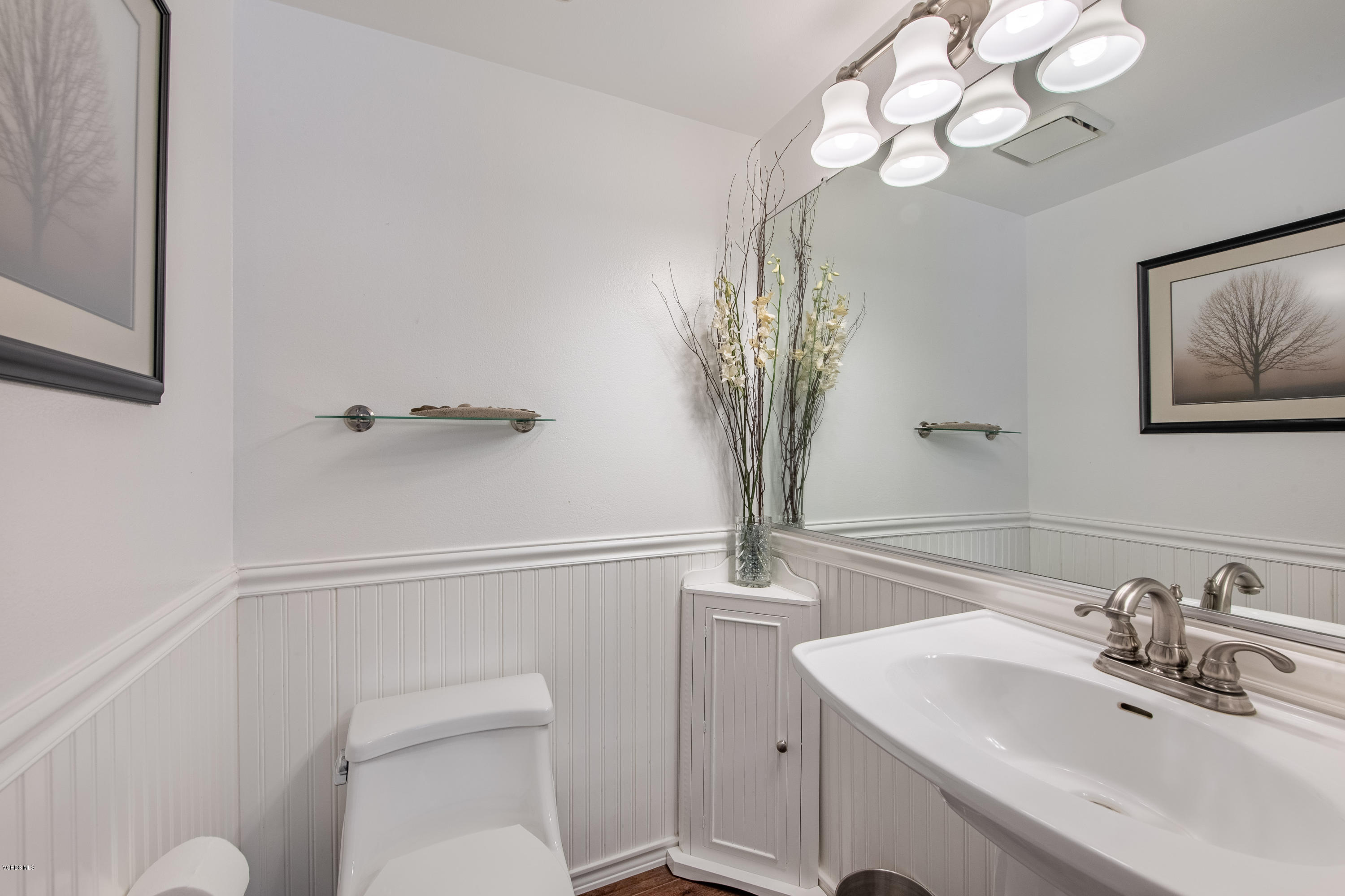 15430 Kernvale Avenue Moorpark, CA 93021 - Photo 8 of 16 a bathroom with a toilet sink and mirror