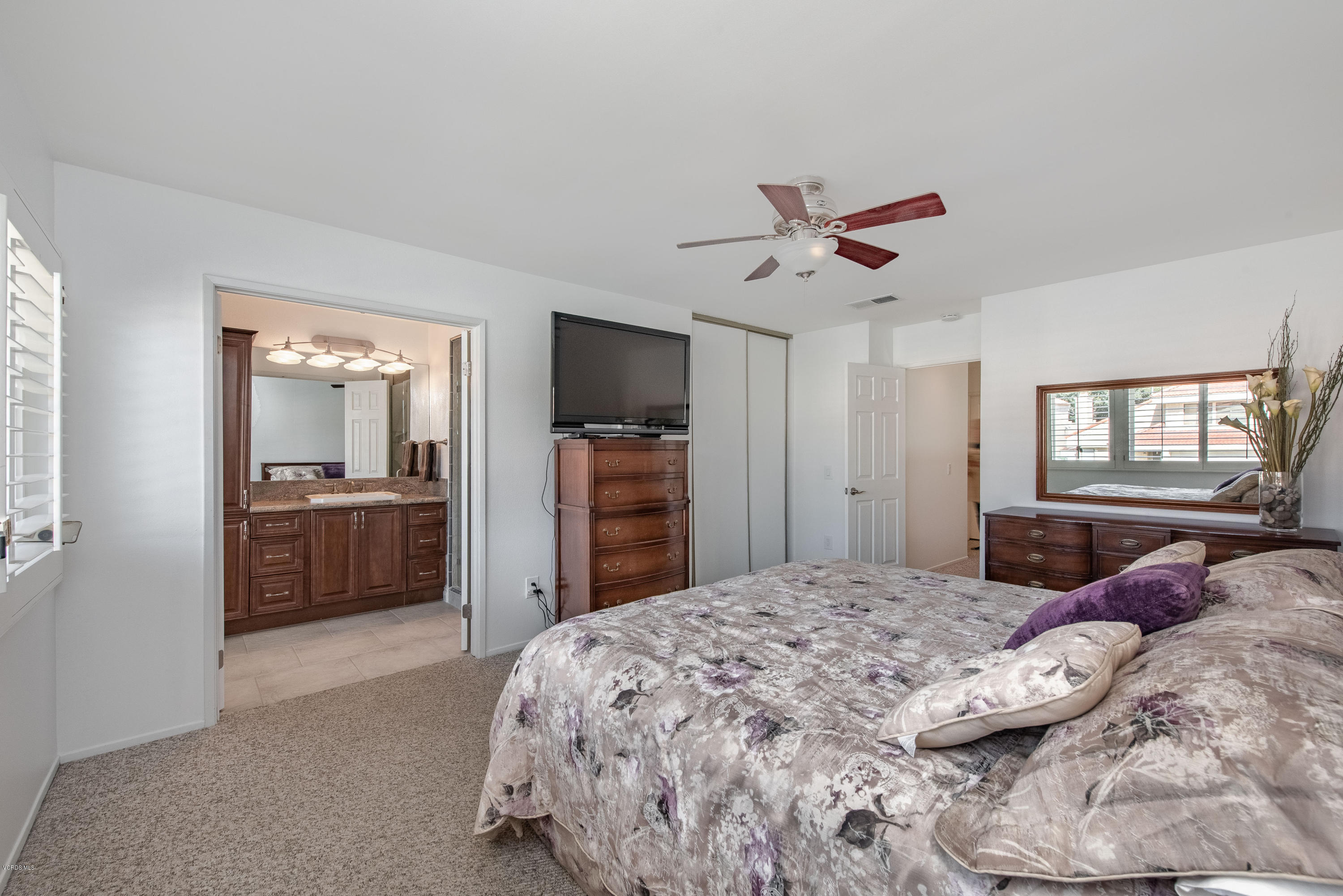 15430 Kernvale Avenue Moorpark, CA 93021 - Photo 9 of 16 a bedroom with a bed and a television