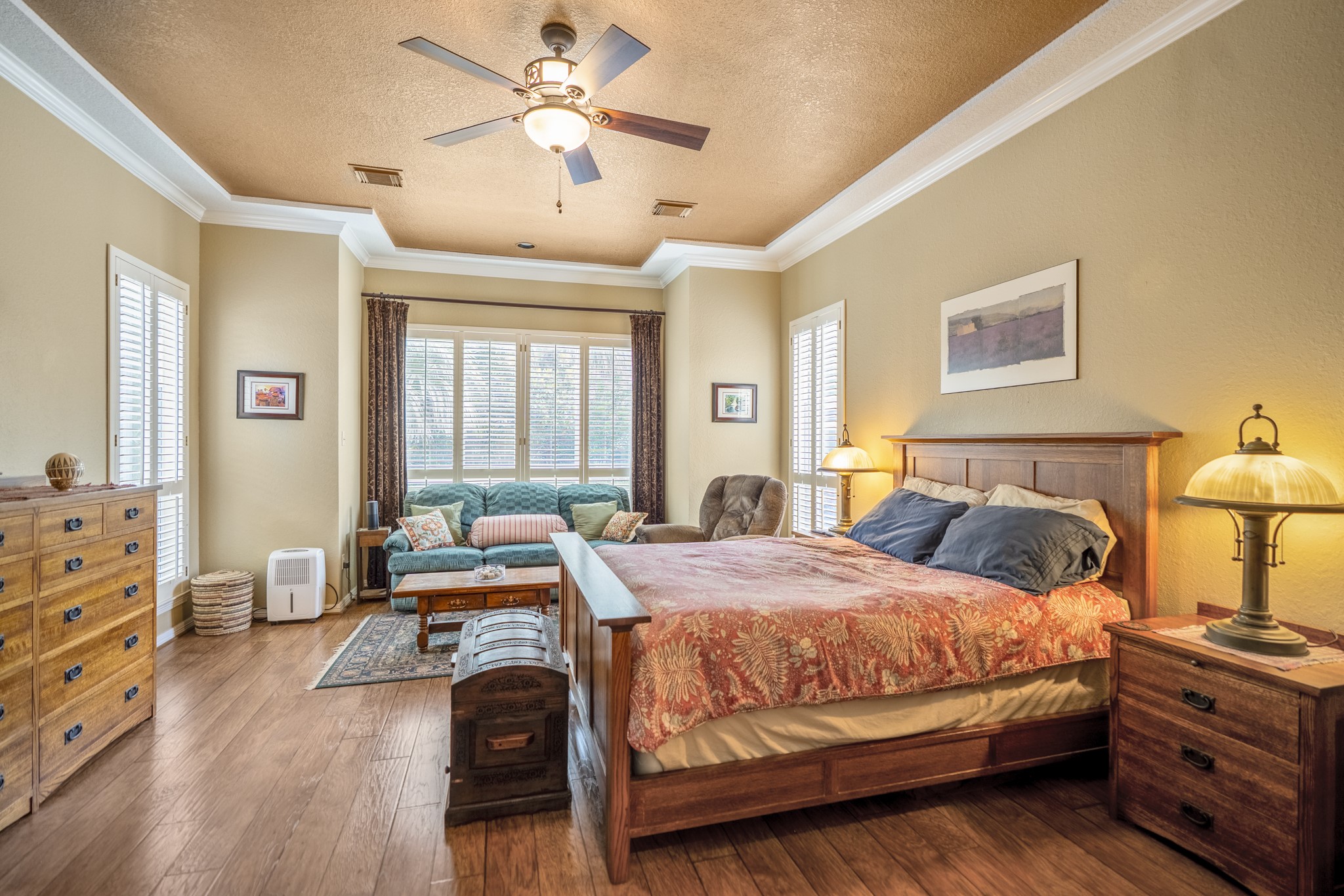 1438 Hatchmere Place Spring, TX 77379 - Photo 17 of 50 A specious primary suite easily accommodates your large furniture as well as having a sitting room area (could be an exercise space) with fabulous views of the backyard.