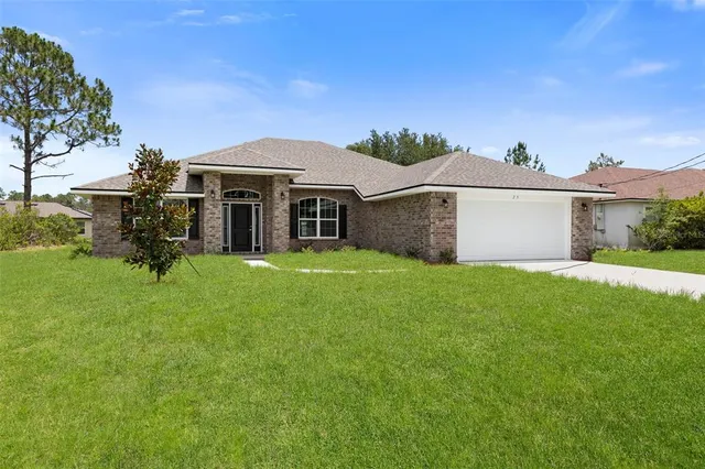 $375,900 | 128 Bird Of Paradise Drive, Palm Coast, FL 32137