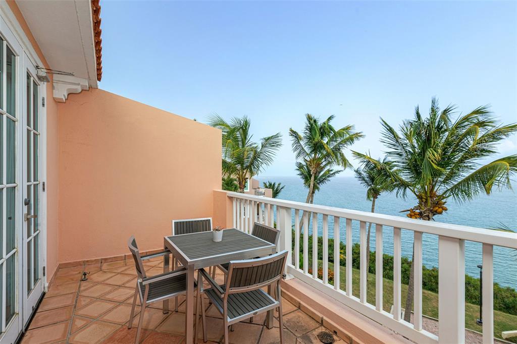 1000 Av. El Conquistador, Unit 51065107 Fajardo, Fajardo 00738 - Photo 1 of 1 a view of a chairs and table on the terrace