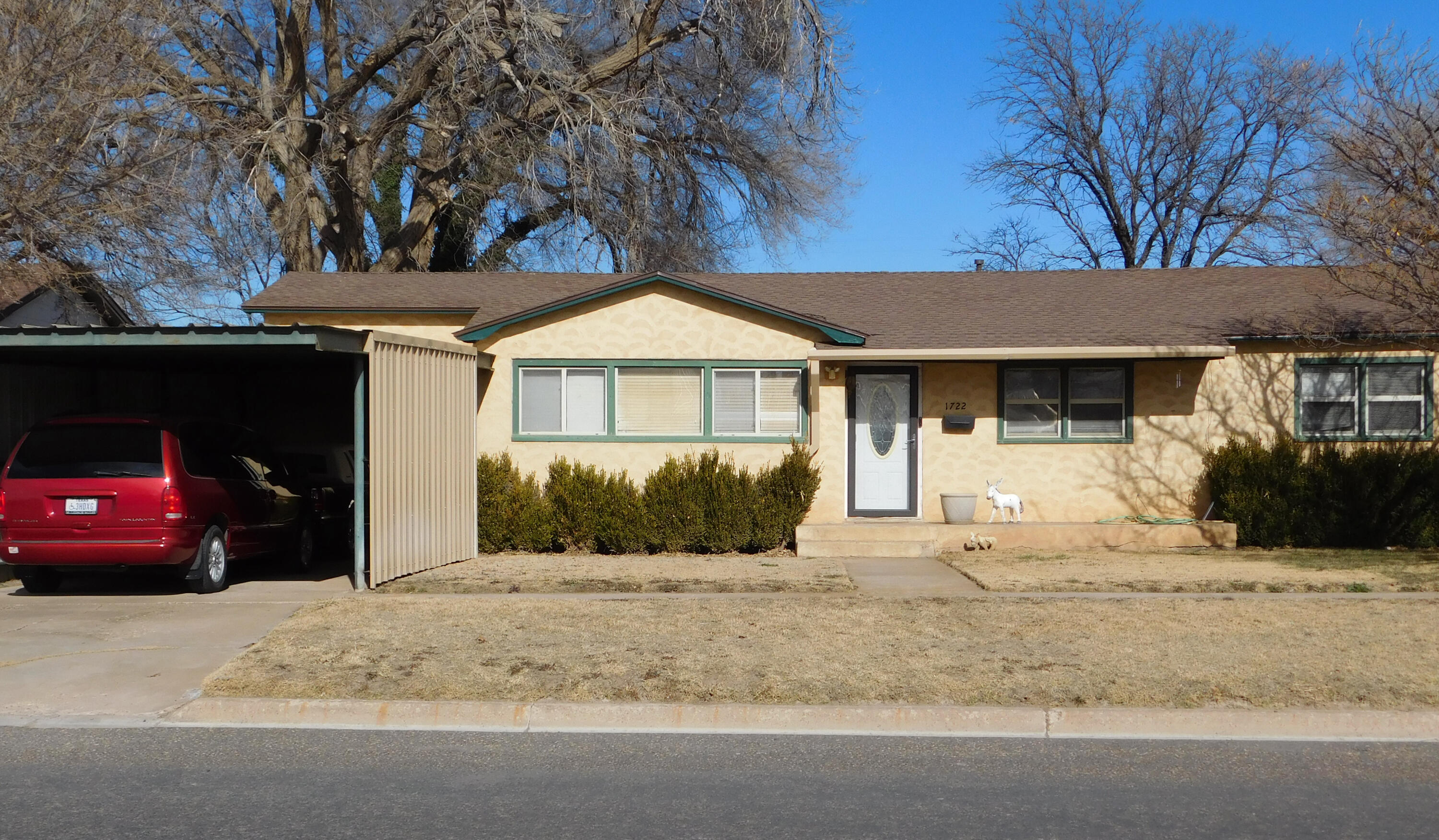 1722 West Ave B Muleshoe, TX 79347 - Photo 20 of 20 a front view of a house with a yard and garage