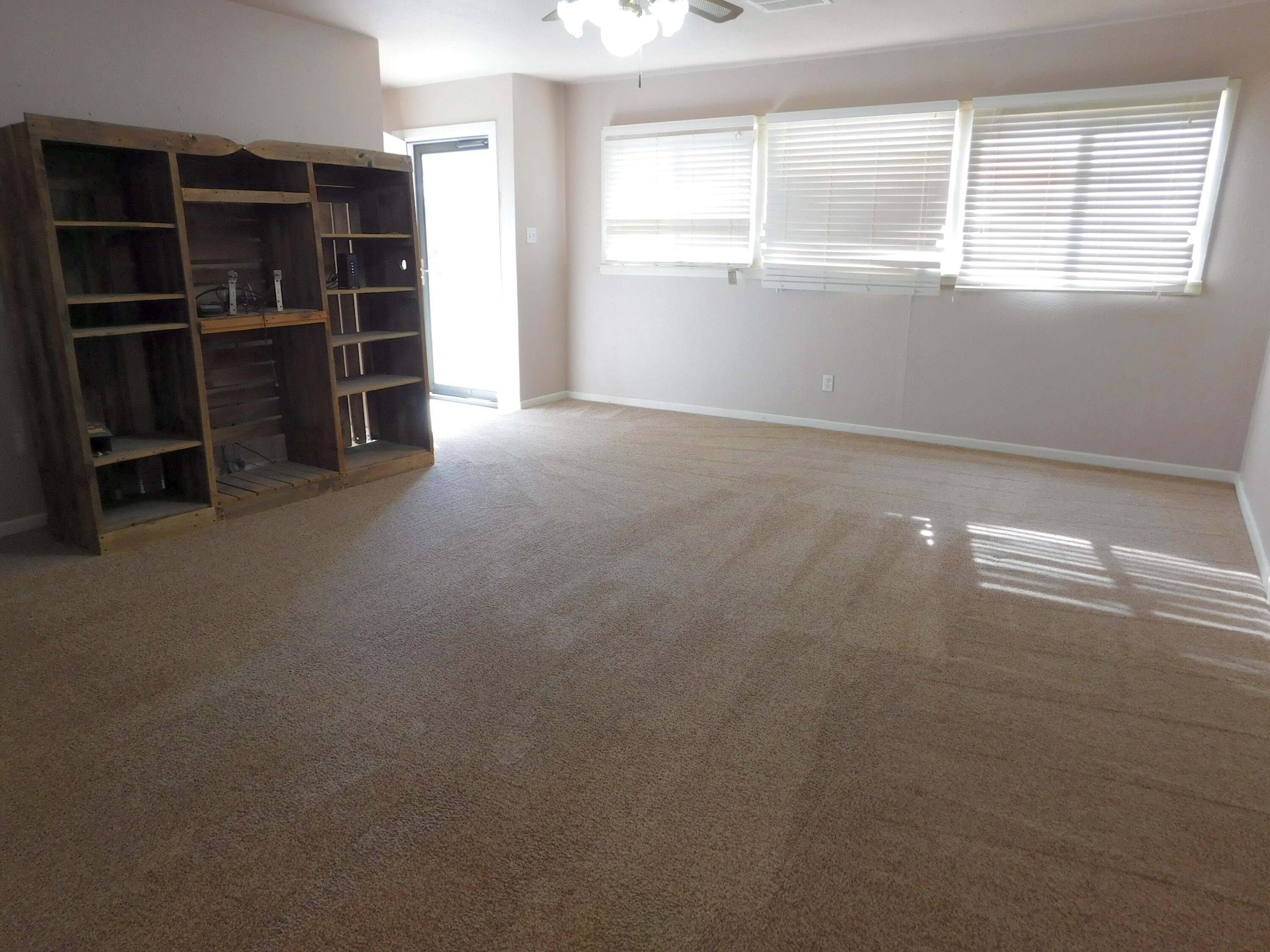 1722 West Ave B Muleshoe, TX 79347 - Photo 2 of 20 a view of an empty room with a window