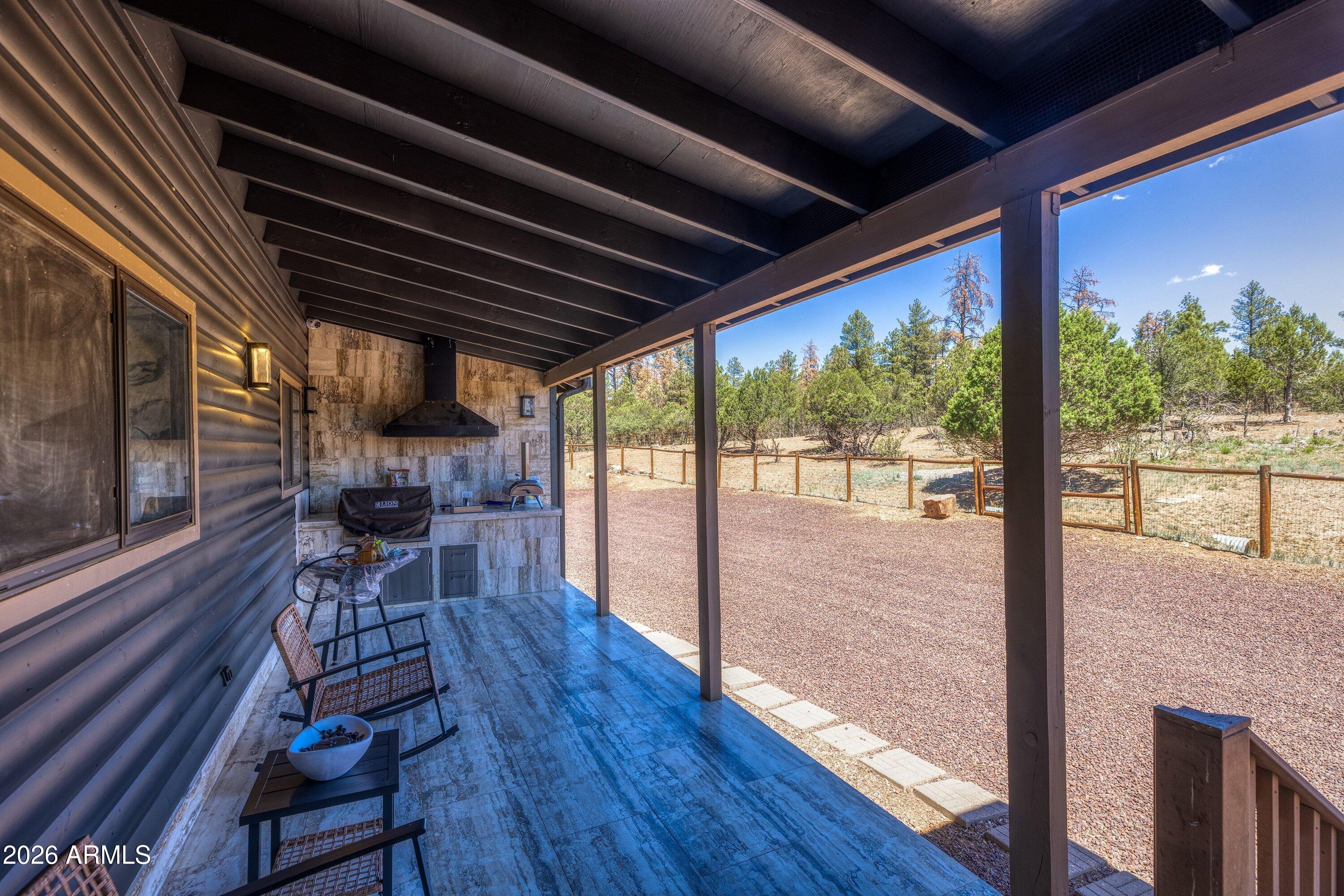 5182 Pinedale Wash Road Pinedale, AZ 85934 - Photo 35 of 54 a view of a porch with furniture and wooden floor