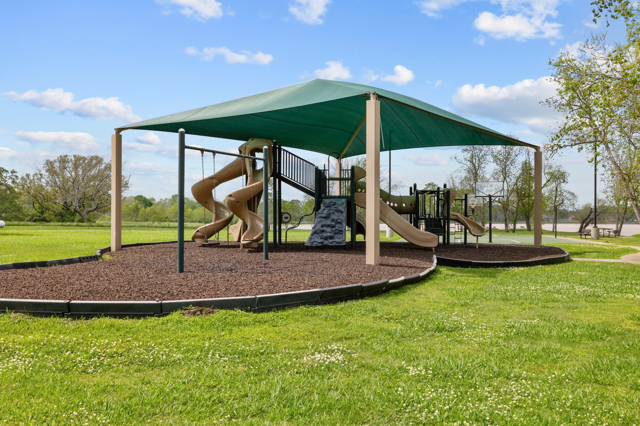 21702 Chenango Lake Drive Angleton, TX 77515 - Photo 18 of 21 a view of a park with slide