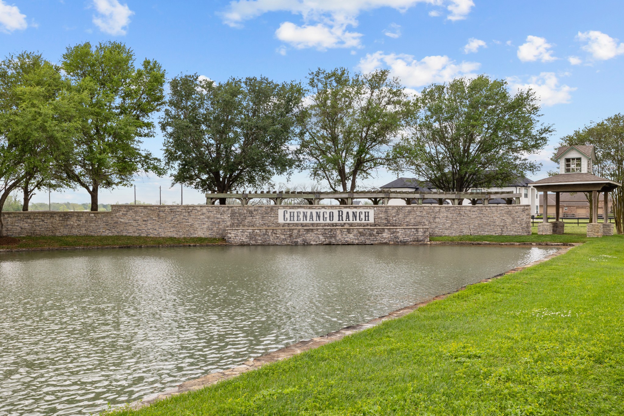 21702 Chenango Lake Drive Angleton, TX 77515 - Photo 2 of 21 a view of a water with a large trees