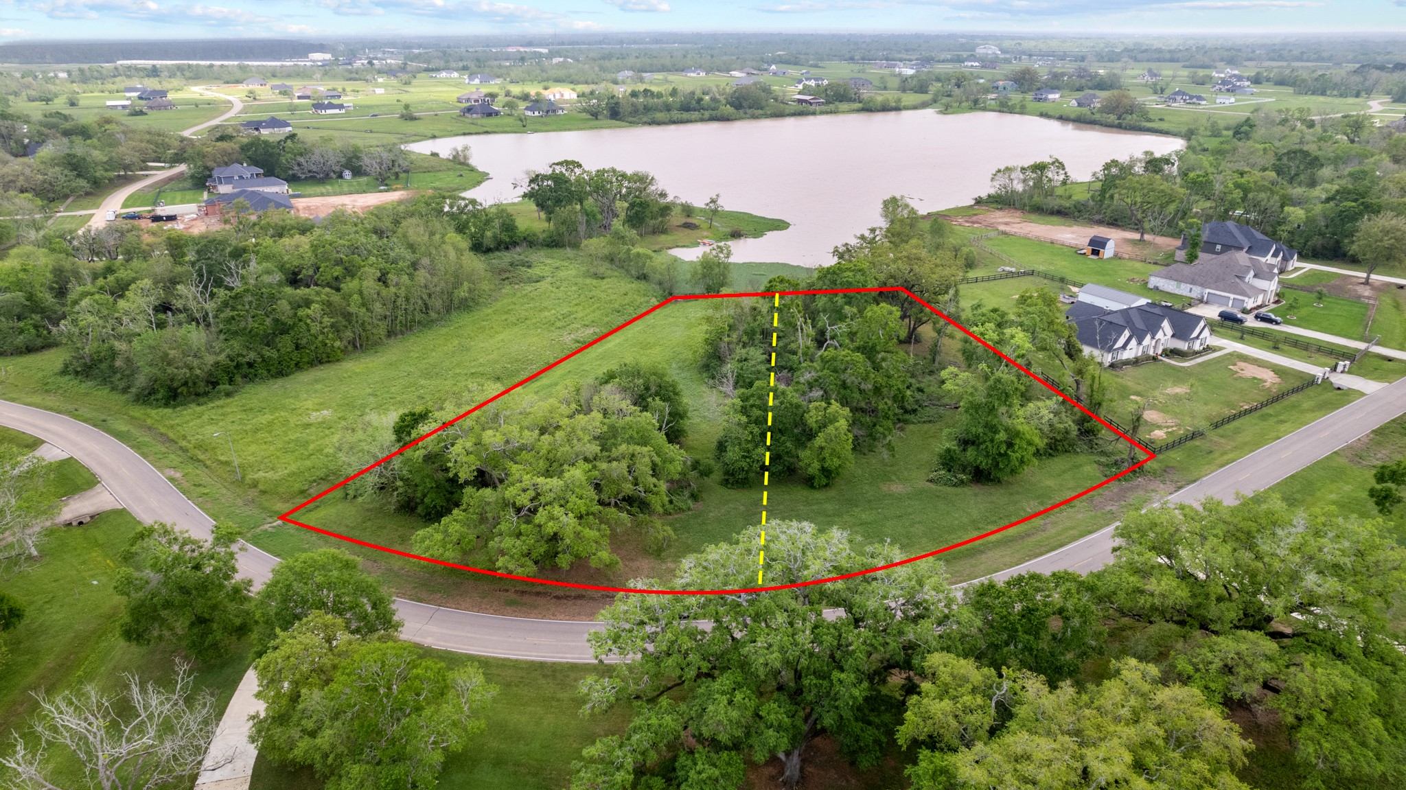 21702 Chenango Lake Drive Angleton, TX 77515 - Photo 10 of 21 an aerial view of lake residential house with outdoor space and seating space