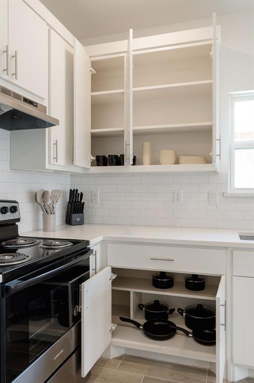 709 Fuller Street Sulphur Springs, TX 75482 - Photo 12 of 22 a stove top oven sitting inside of a kitchen