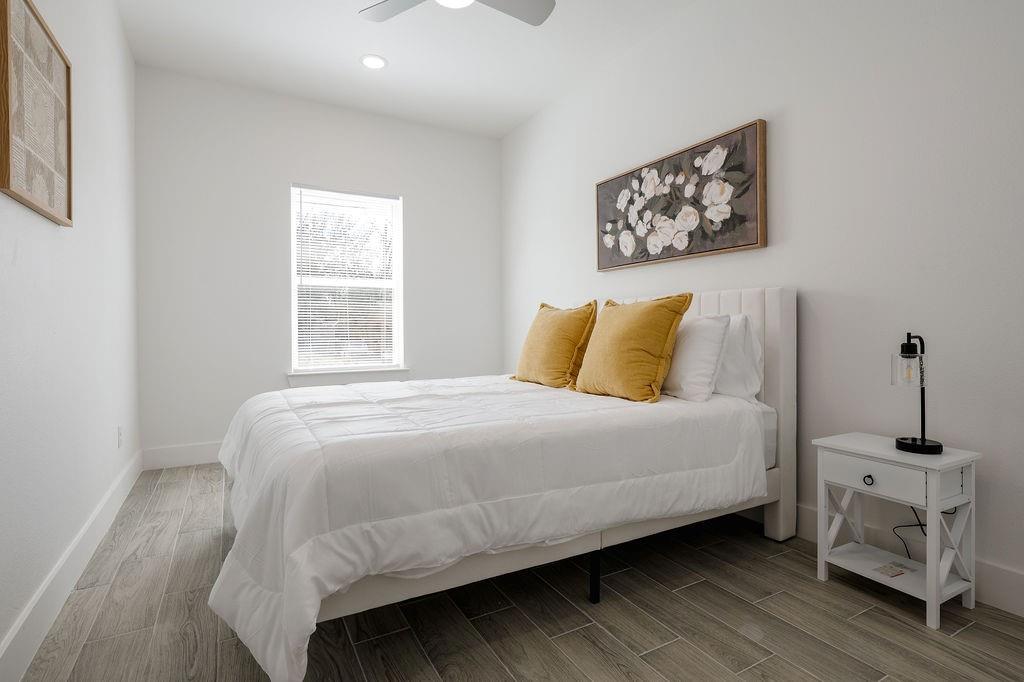 709 Fuller Street Sulphur Springs, TX 75482 - Photo 15 of 22 a bedroom with a bed and a window