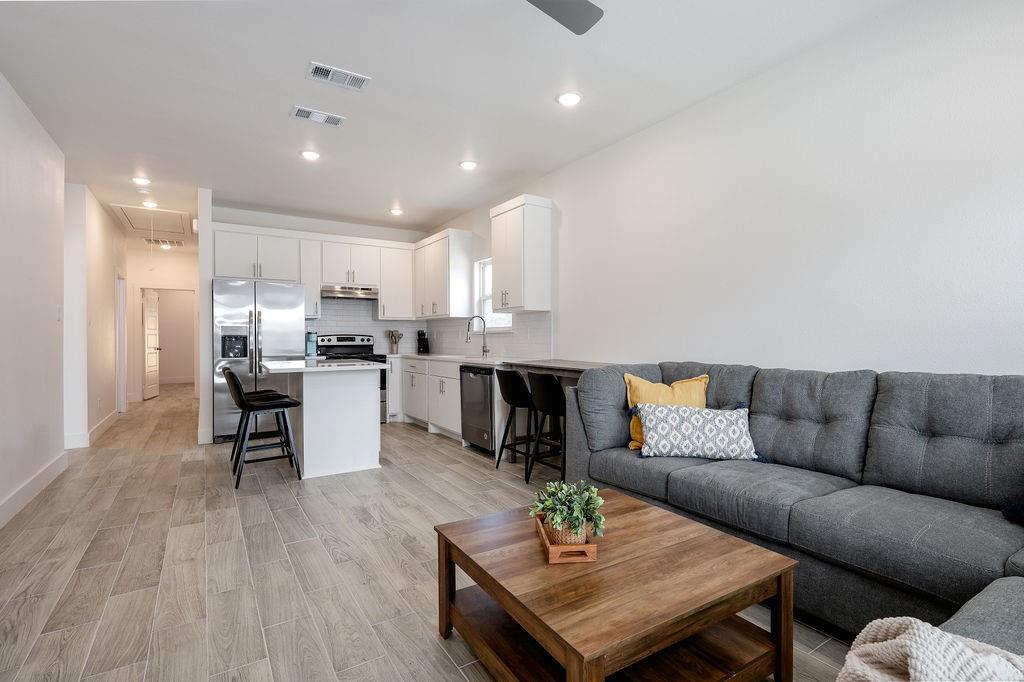 709 Fuller Street Sulphur Springs, TX 75482 - Photo 3 of 22 a living room with furniture and kitchen view