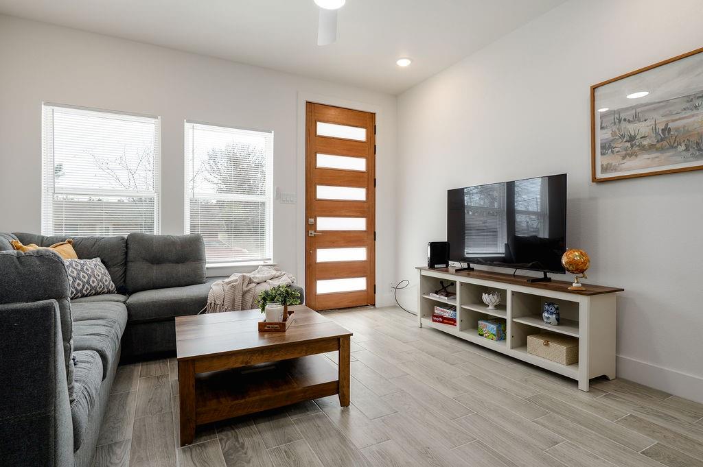 709 Fuller Street Sulphur Springs, TX 75482 - Photo 5 of 22 a living room with furniture and a flat screen tv