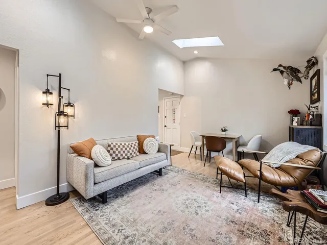 a living room with furniture and a rug