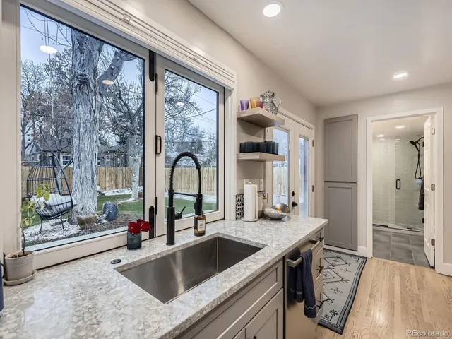 a kitchen with a sink and a refrigerator