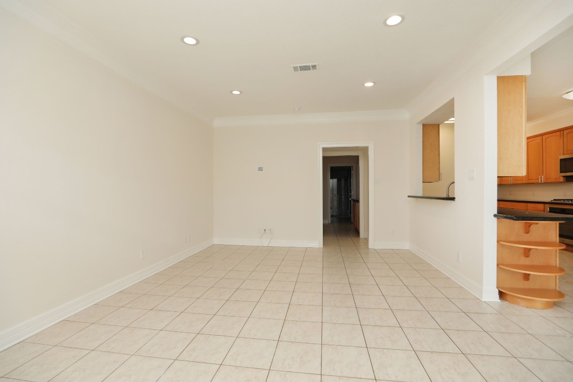 7499 Brompton Street, Unit 7499 Houston, TX 77025 - Photo 12 of 43 a view of an empty room with a window