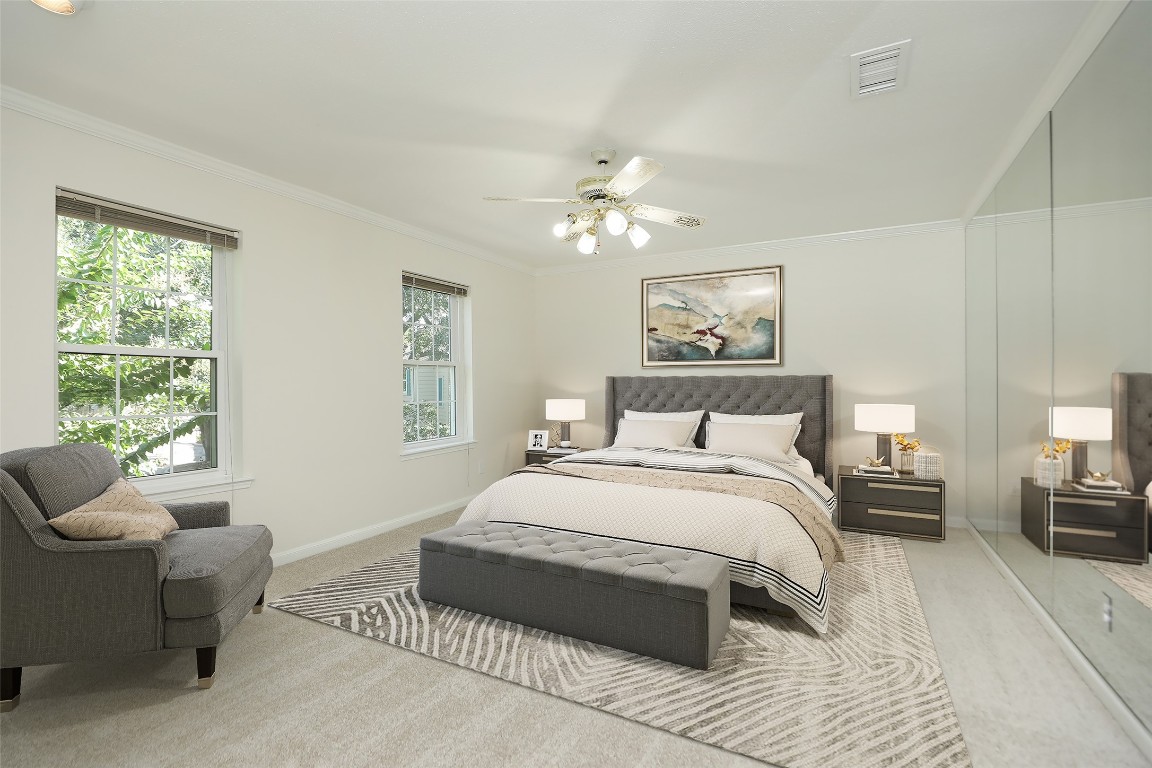 7499 Brompton Street, Unit 7499 Houston, TX 77025 - Photo 24 of 43 a spacious bedroom with a bed a couch and a window