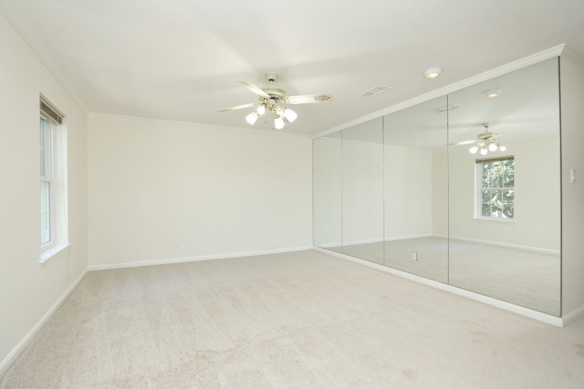 7499 Brompton Street, Unit 7499 Houston, TX 77025 - Photo 27 of 43 wooden floor in an empty room with a window