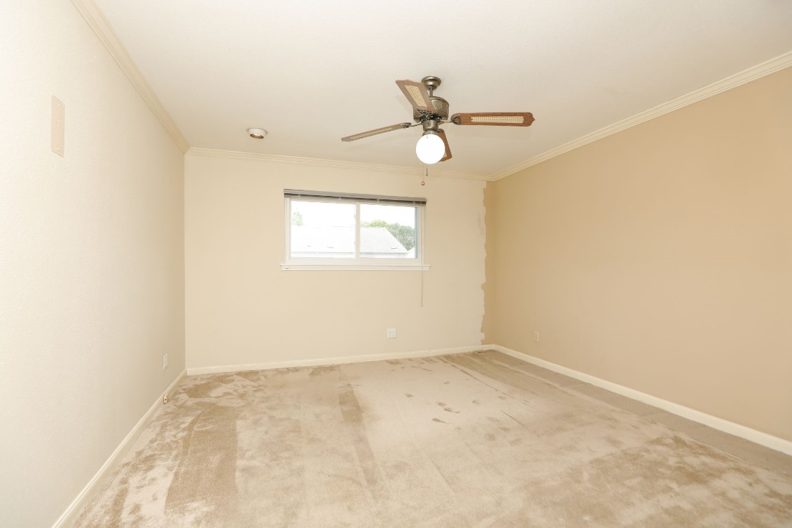 7499 Brompton Street, Unit 7499 Houston, TX 77025 - Photo 31 of 43 an empty room with a window