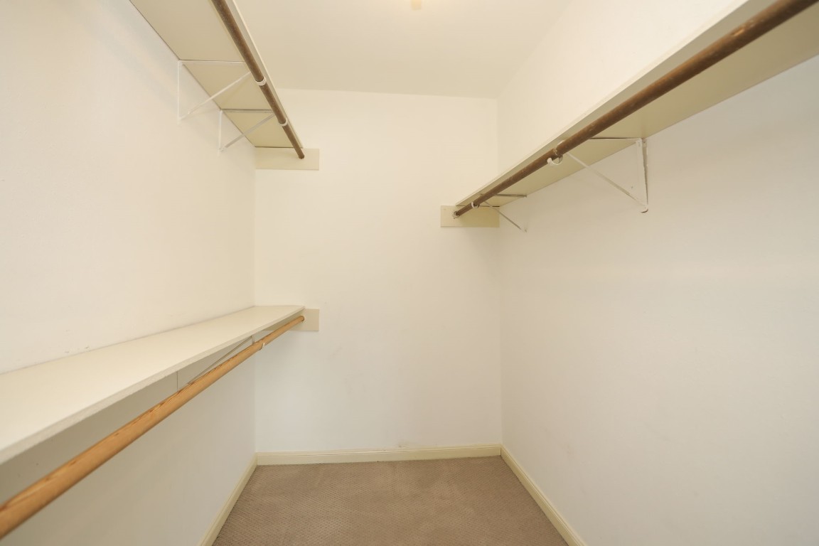 7499 Brompton Street, Unit 7499 Houston, TX 77025 - Photo 33 of 43 a view of a room with racks on the wall