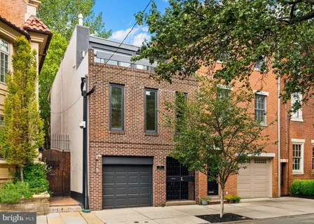a view of a house with a tree front
