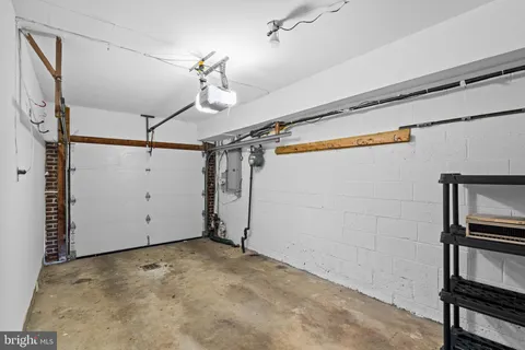 a kitchen with stainless steel appliances granite countertop a stove top oven a sink dishwasher a refrigerator and a microwave