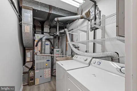 a kitchen with sink a granite counter and a sink