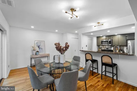 a view of a dining room with furniture and wooden floor