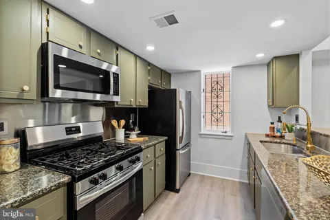 a living room with furniture fireplace and a flat screen tv