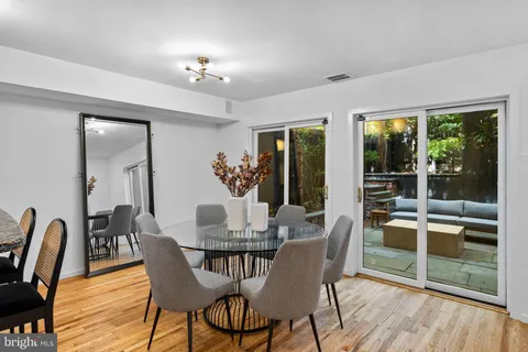 a vase of flowers sitting on a dining table