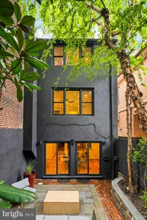 a living room with fireplace furniture and a flat screen tv