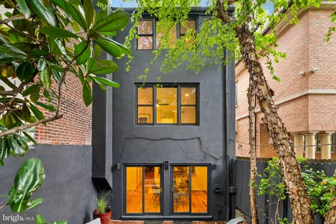 a kitchen with a cabinets and a stove top oven