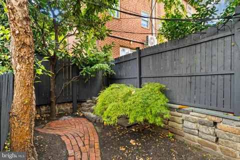 a bathroom with a shower and a mirror