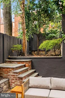 a view of workspace with wooden floor and a window