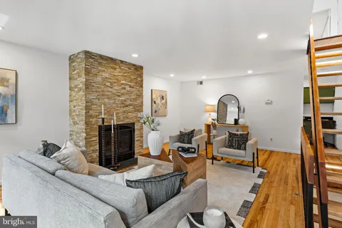 a bathroom with a granite countertop shower