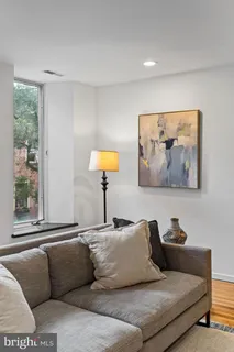 a view of room with furniture and wooden floor