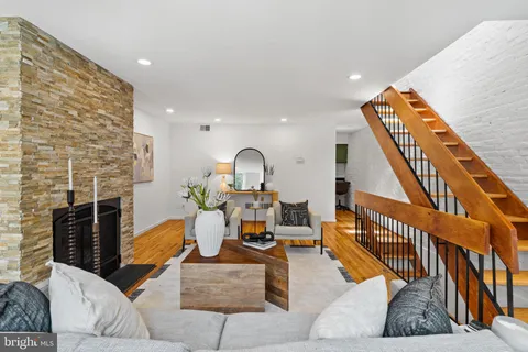 a bedroom with two beds and potted plant