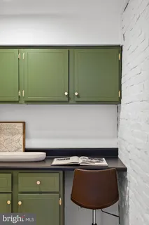 a bedroom with two bed and a chair