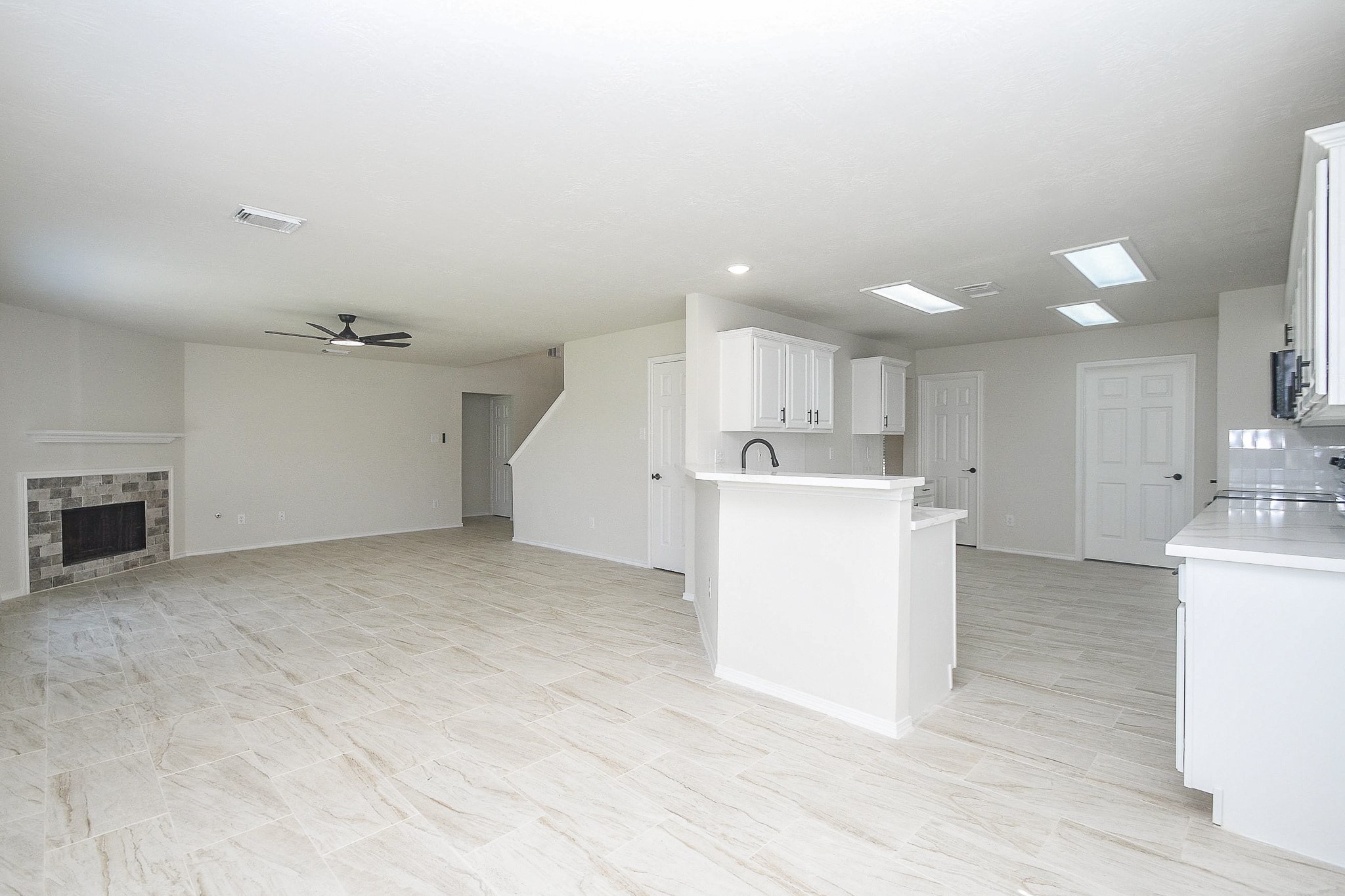 4810 Arbor Court Rosenberg, TX 77471 - Photo 9 of 20 a view of a kitchen with a sink and a microwave