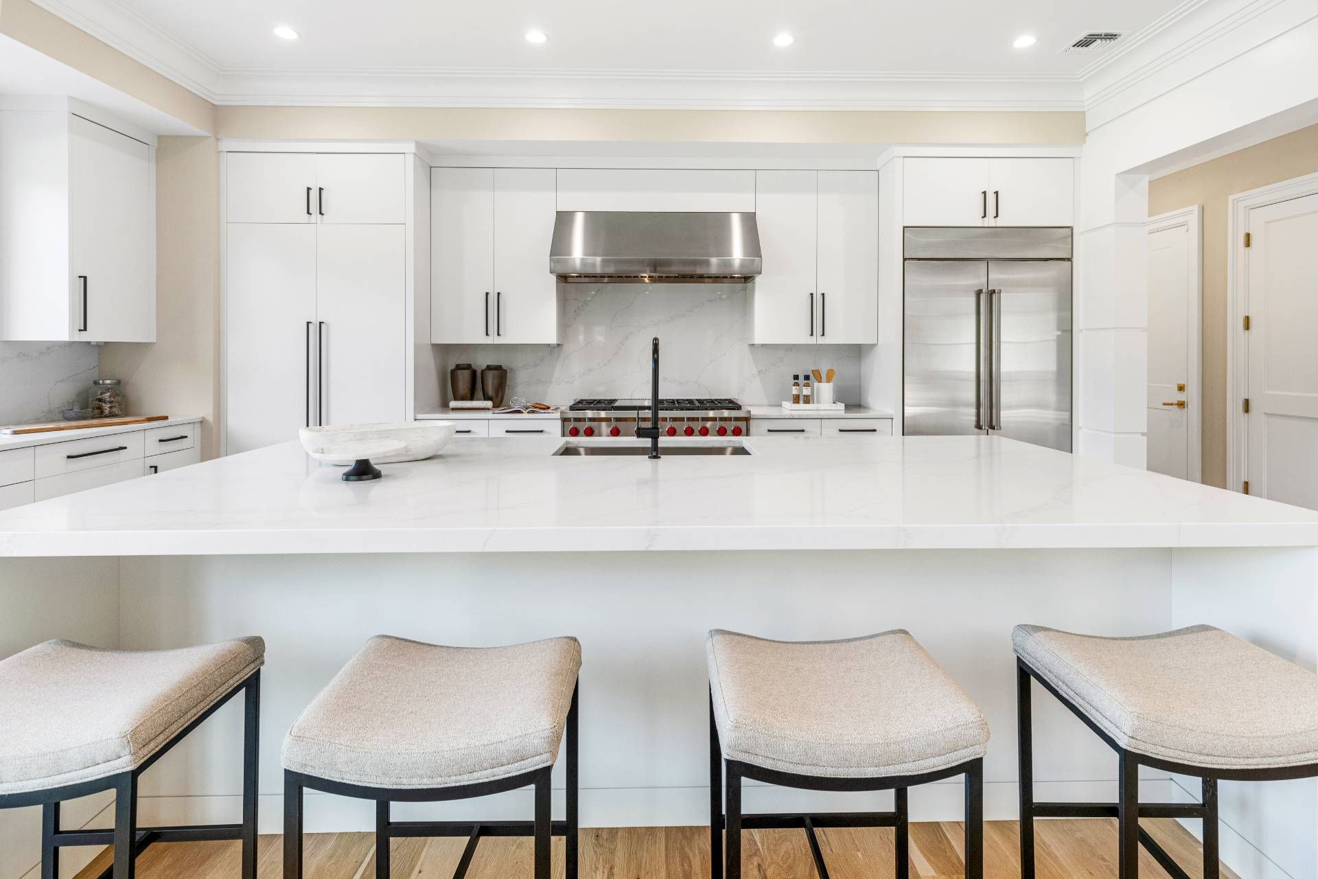 21 Cedar Lane Remsenburg, NY 11960 - Photo 18 of 50 a kitchen with stainless steel appliances a sink and chairs