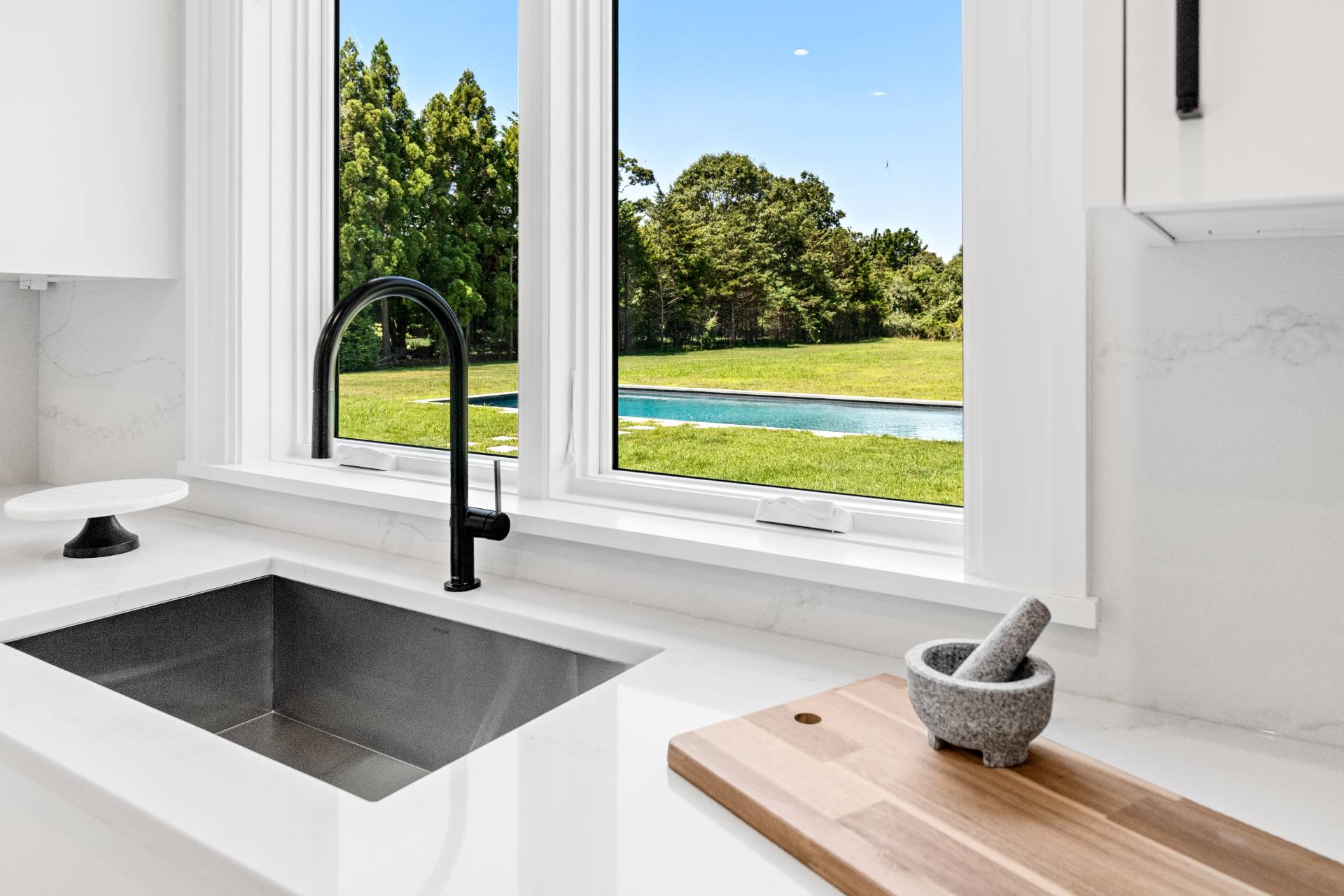21 Cedar Lane Remsenburg, NY 11960 - Photo 23 of 50 a kitchen with a sink and a large window