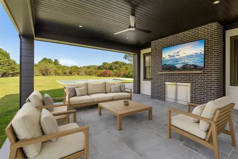 a view of a dining room with furniture and a wooden floor