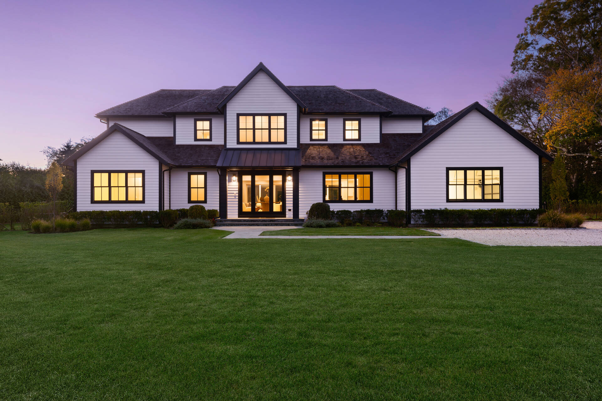 21 Cedar Lane Remsenburg, NY 11960 - Photo 3 of 50 a front view of a house with a yard and trees