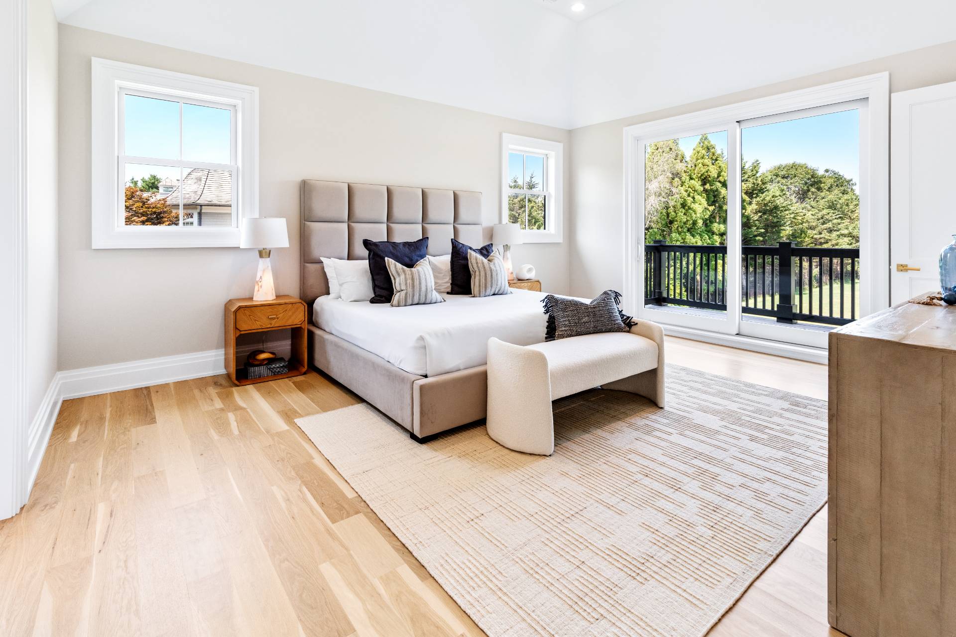 21 Cedar Lane Remsenburg, NY 11960 - Photo 32 of 50 a spacious bedroom with a bed and large windows