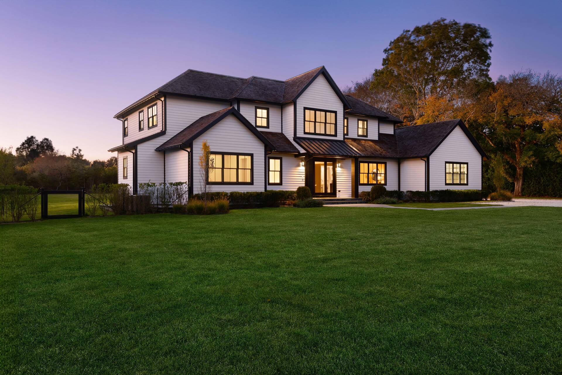 21 Cedar Lane Remsenburg, NY 11960 - Photo 5 of 50 a front view of a house with a garden and yard