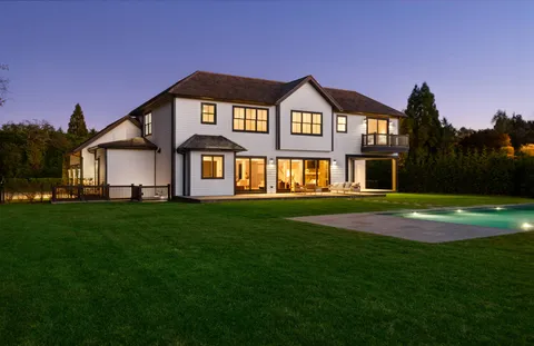 a front view of a house with a yard