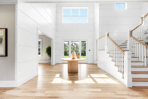 a view of living room kitchen with furniture and large window