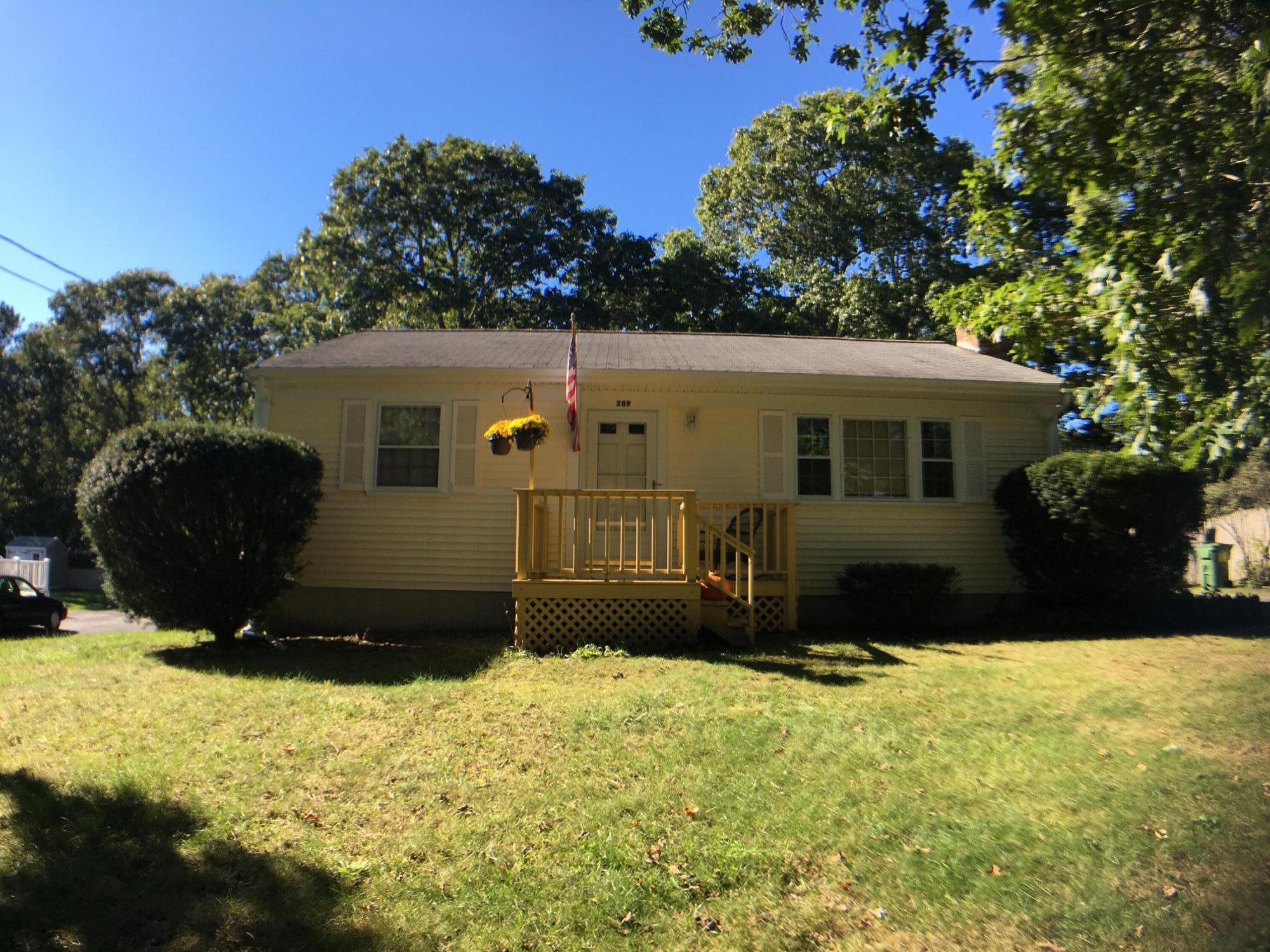 a front view of a house with a yard